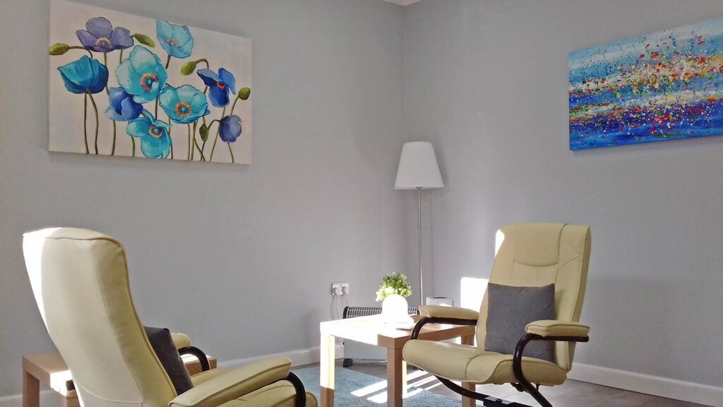 Therapy room for hire in Manchester which includes a room like this good chairs, artwork and privacy